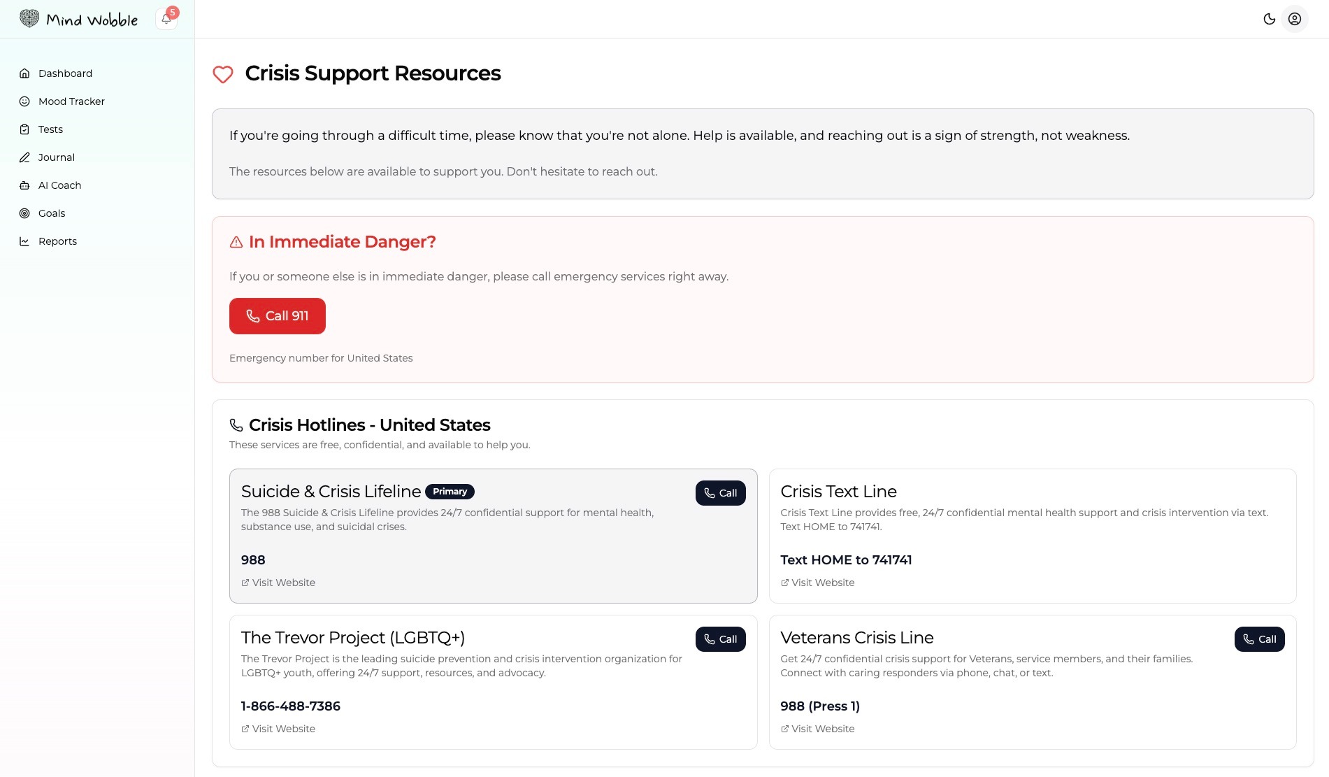 Show the Mind Wobble crisis support page with emergency number, crisis hotline cards, resource links, and grounding tips visible.